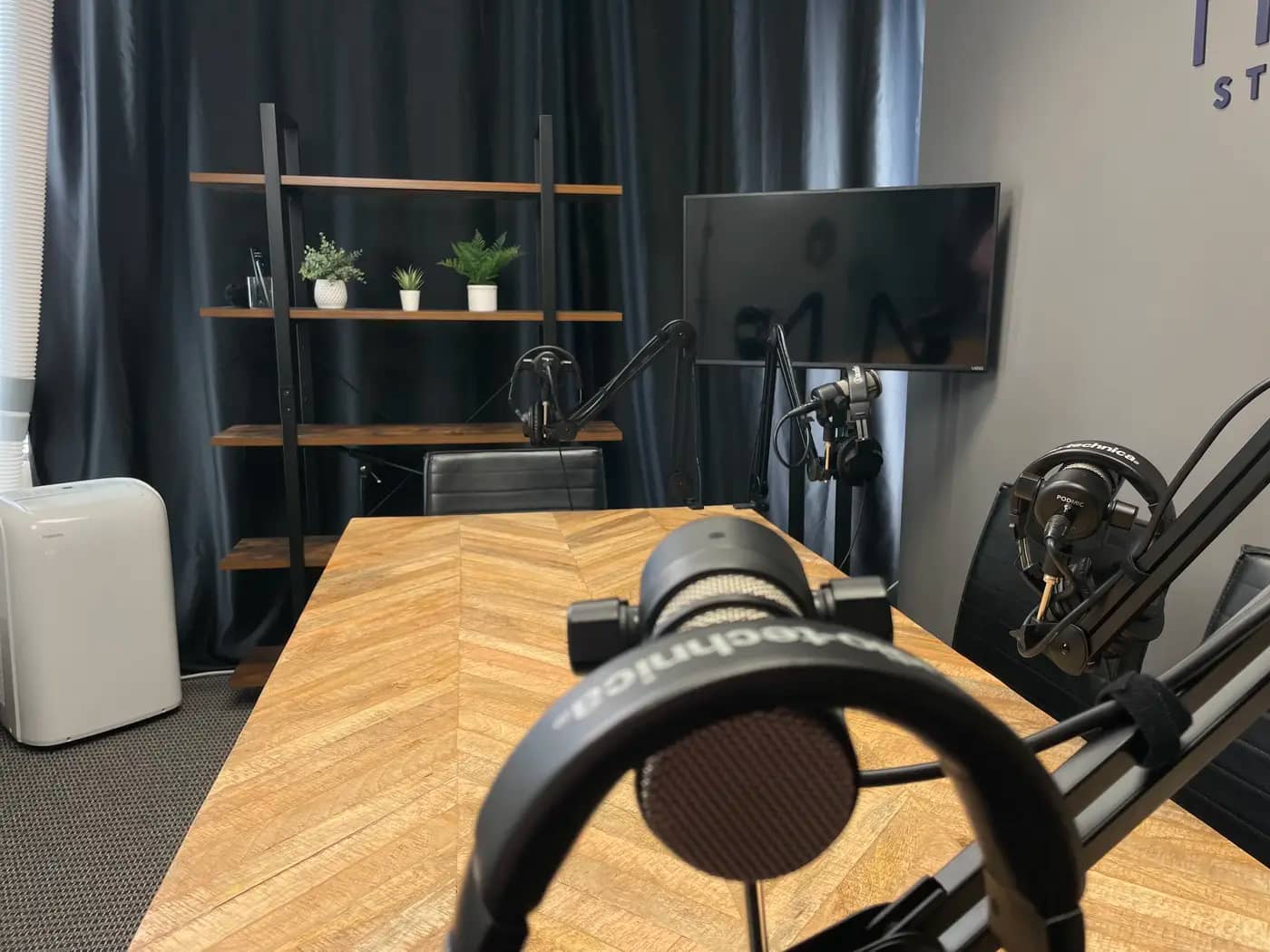 The Iron flagship recording suite at the Sierra Media Productions Dallas podcast studio, view 3
